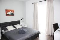 Posteľ alebo postele v izbe v ubytovaní Apartmani Žužić