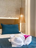Postel nebo postele na pokoji v ubytování Marinos Beach Hotel