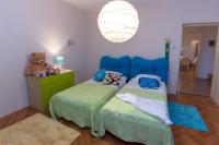Posteľ alebo postele v izbe v ubytovaní Apartment Varga