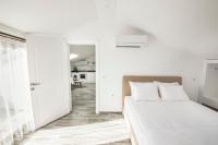 Postel nebo postele na pokoji v ubytování Cedrus Suites