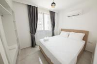 Postel nebo postele na pokoji v ubytování Cedrus Suites