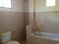 a bathroom with a toilet and a bath tub at Malibu Beach Bungalows in Chaloklum