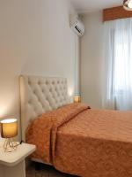 Posteľ alebo postele v izbe v ubytovaní Canaletto Apartments