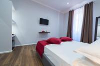 A bed or beds in a room at Rent Rooms Trastevere