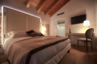 Postel nebo postele na pokoji v ubytování Agriturismo Villa Trovatore