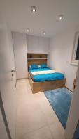 Ein Bett oder Betten in einem Zimmer der Unterkunft Apartman Mateo