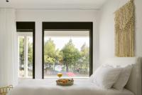 Posteľ alebo postele v izbe v ubytovaní Amantes Villas and Suites