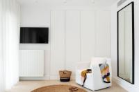 Televízia a/alebo spoločenská miestnosť v ubytovaní Amantes Villas and Suites
