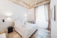 Posteľ alebo postele v izbe v ubytovaní Giovì Relais