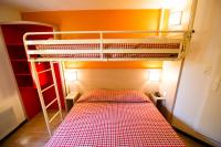 a small room with a bunk bed and a ladder at Premiere Classe Orleans Ouest - La Chapelle St Mesmin in La Chapelle-Saint-Mesmin