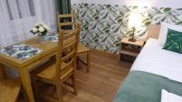 Łóżko lub łóżka w pokoju w obiekcie Villa Magnolia