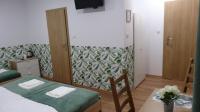 Łóżko lub łóżka w pokoju w obiekcie Villa Magnolia