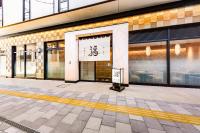 an entrance to a building with a sign on it at Hotel Hanshin Annex Osaka in Osaka