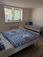 Postel nebo postele na pokoji v ubytování Apartmány Zaječák