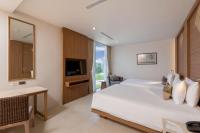 Postel nebo postele na pokoji v ubytování Splash Beach Resort, Maikhao Phuket - SHA Extra Plus