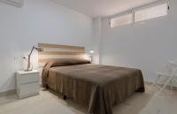Postel nebo postele na pokoji v ubytování Apartamentos Moraira