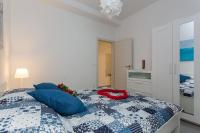 Postel nebo postele na pokoji v ubytování Apartments Luksic