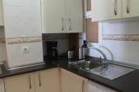 Kuchyň nebo kuchyňský kout v ubytování Sur Suites Torremolinos