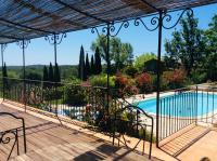 a view from the balcony of a villa with a swimming pool at La Bastide des Cairns in Seillans