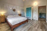 Łóżko lub łóżka w pokoju w obiekcie Happy hill - appartamento Quercia - natura e relax