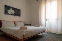 Łóżko lub łóżka w pokoju w obiekcie veronaeasyapartments