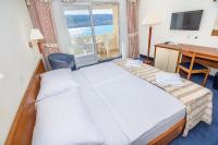 Postel nebo postele na pokoji v ubytování Family Hotel Pagus - All Inclusive