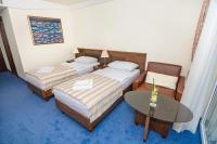 Postel nebo postele na pokoji v ubytování Family Hotel Pagus - All Inclusive