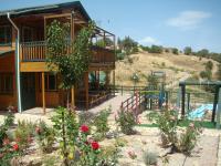 Bazén v ubytovaní Zeus-Village οικισμός φινλανδικών chalet με πισίνες & γυμναστήριο alebo v jeho blízkosti