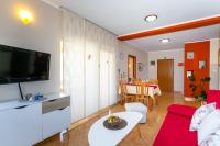 Televízia a/alebo spoločenská miestnosť v ubytovaní Apartment Medved