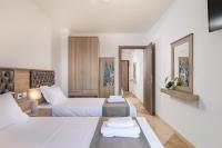 Posteľ alebo postele v izbe v ubytovaní Jolandas Suites