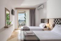 Posteľ alebo postele v izbe v ubytovaní Jolandas Suites