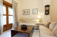 a living room with a couch and a coffee table at Casa Singular , parking gratis in Jerez de la Frontera