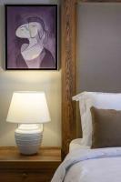 A bed or beds in a room at Minaret Suites and Apartments