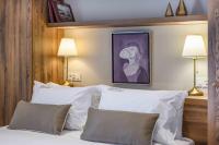 A bed or beds in a room at Minaret Suites and Apartments