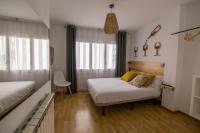 Postel nebo postele na pokoji v ubytování Tinto Dreams Hostel