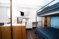 Ein Bett oder Betten in einem Zimmer der Unterkunft West Side YMCA