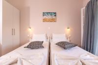 Łóżko lub łóżka w pokoju w obiekcie Relax Studios Corfu