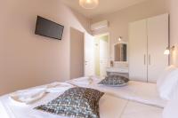 Łóżko lub łóżka w pokoju w obiekcie Relax Studios Corfu