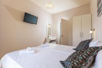 Łóżko lub łóżka w pokoju w obiekcie Relax Studios Corfu