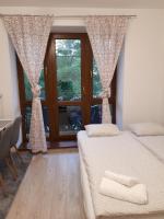 Posteľ alebo postele v izbe v ubytovaní Emily Apartment