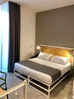 Posteľ alebo postele v izbe v ubytovaní Residence Hotel Moderno