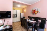 Televízia a/alebo spoločenská miestnosť v ubytovaní Apartment Medved
