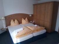 Łóżko lub łóżka w pokoju w obiekcie Hotel Garni Alpenruh-Micheluzzi