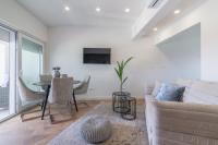 Televízia a/alebo spoločenská miestnosť v ubytovaní Luxury Piano apartment