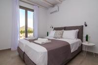 Postel nebo postele na pokoji v ubytování IL SOGNO VILLAS Paros