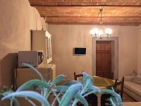 Televízia a/alebo spoločenská miestnosť v ubytovaní Le Camere Del Borgo