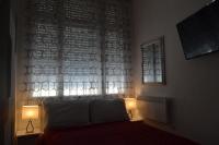 Posteľ alebo postele v izbe v ubytovaní City Corso Apartman