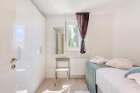 Postel nebo postele na pokoji v ubytování Spacious Family Apartment MM