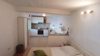 Kuchyň nebo kuchyňský kout v ubytování Studio Apartment MojMir