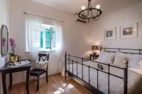 Postel nebo postele na pokoji v ubytování Ortenca Apartment